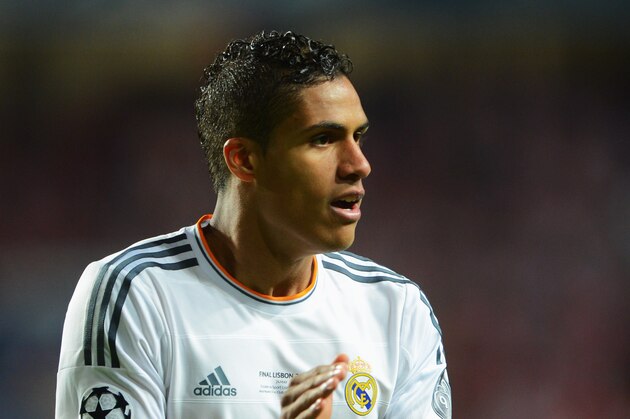 LISBON, PORTUGAL - MAY 24:  Raphael Varane of Real Madrid applauds during the UEFA Champions League Final between Real Madrid and Atletico de Madrid at Estadio da Luz on May 24, 2014 in Lisbon, Portugal.  (Photo by Michael Regan/Getty Images)