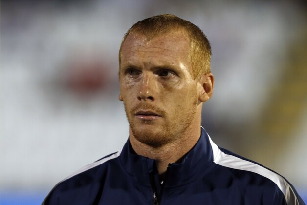 France's Jeremy Mathieu stands during the playing of his country's national anthem before the start of their international friendly soccer match against Serbia, in Belgrade, Serbia, Sunday, Sept. 7, 2014. (AP Photo/Darko Vojinovic)