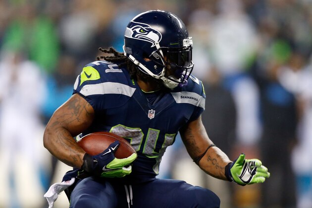 SEATTLE, WA - JANUARY 10:  Marshawn Lynch #24 of the Seattle Seahawks runs the ball against the Carolina Panthers during the 2015 NFC Divisional Playoff game at CenturyLink Field on January 10, 2015 in Seattle, Washington.  (Photo by Otto Greule Jr/Getty Images)