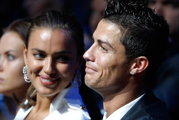 Real Madrid's Portuguese forward Cristiano Ronaldo , right, is seen with his girlfriend, Russian top  model Irina Shayk, during the UEFA Champions League draw in Monaco, Thursday, Aug. 30, 2012. (AP Photo/Claude Paris)