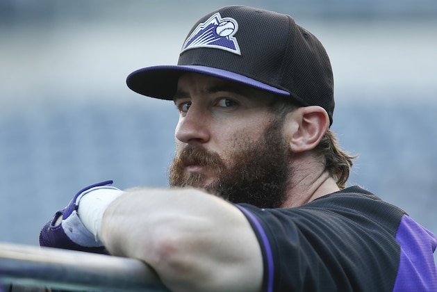 Colorado Rockies right fielder Charlie Blackmon rest on the back of the batting cage during warmups prior to a baseball game against the San Diego Padres Monday, Sept. 22, 2014, in San Diego.  (AP Photo/Lenny Ignelzi)