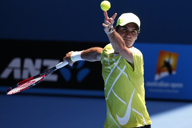 Roger Federer of Switzerland practices serving at the Australian Open tennis championship in Melbourne, Australia, Saturday, Jan. 17, 2015. (AP Photo/Vincent Thian)