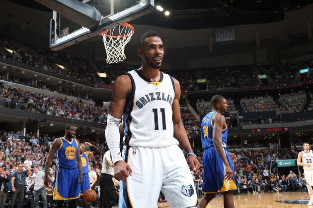 MEMPHIS, TN - DECEMBER 16:  Mike Conley #11 of the Memphis Grizzlies celebrates during the game against the Golden State Warriors on December 16, 2014 at the FedExForum in Memphis, Tennessee.  NOTE TO USER: User expressly acknowledges and agrees that, by downloading and or using this Photograph, user is consenting to the terms and conditions of the Getty Images License Agreement. Mandatory Copyright Notice: Copyright 2014 NBAE (Photo by Joe Murphy/NBAE via Getty Images)