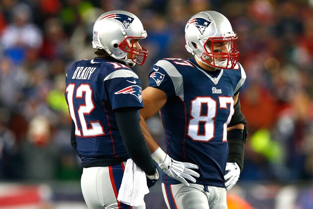 FOXBORO, MA - JANUARY 10:  Tom Brady #12 speaks turnover  Rob Gronkowski #87 of the New England Patriots in the first half after a play against the Baltimore Ravens during the 2014 AFC Divisional Playoffs game at Gillette Stadium on January 10, 2015 in Foxboro, Massachusetts.  (Photo by Jared Wickerham/Getty Images)