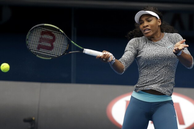 Serena Williams of the US hits a forehand return during a practice session on Rod Laver Arena ahead of the Australian Open tennis championship in Melbourne, Australia, Thursday, Jan. 15, 2015. (AP Photo/Mark Baker)