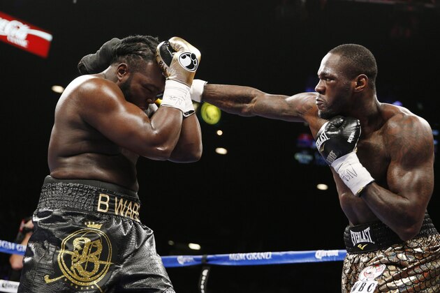Deontay Wilder hits Bermane Stiverne during their WBC heavyweight title boxing bout Saturday, Jan. 17, 2015, in Las Vegas. (AP Photo/John Locher)