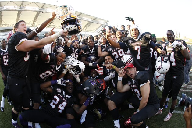 17 January 2015: Members of the National team celebrate after their victory at the NFL Collegiate Bowl on January 17, 2015 in Carson, Calif. (Ric Tapia/AP Images for NFL Players Association)