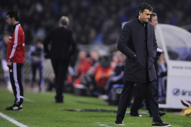 Barcelona’s head coach Luis Enrique, right,  gestures during their La Liga soccer match between Real Sociedad and Barcelona, at Anoeta stadium in San Sebastian, northern Spain, Sunday, Jan.4, 2015. Barcelona lost the match 1-0. (AP Photo/Alvaro Barrientos)