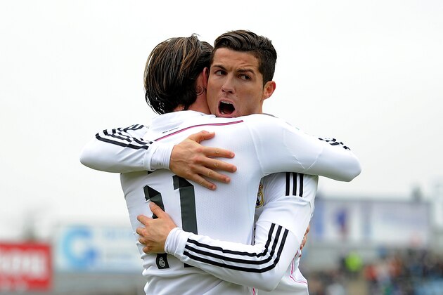GETAFE, SPAIN - JANUARY 18:  Gareth Bale of Real Madrid celebrates with Cristiano Ronaldo after scoring his team's 2nd goal during the La Liga match between Getafe CF and Real Madrid CF at Coliseum Alfonso Perez stadium on January 18, 2015 in Getafe, Spain.  (Photo by Denis Doyle/Getty Images)