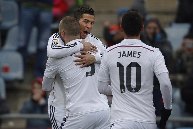 Real Madrid's Cristiano Ronaldo, centre, celebrates his goal with team mates during a Spanish La Liga soccer match between Getafe and Real Madrid at the Coliseum Alfonso Perez stadium in Madrid, Spain, Sunday, Jan. 18, 2015. (AP Photo/Andres Kudacki)