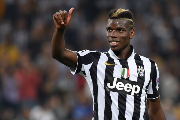 TURIN, ITALY - SEPTEMBER 16:  Paul Pogba of Juventus salutes the fans at the end of the UEFA Champions League Group A match between Juventus and Malmo FF on September 16, 2014 in Turin, Italy.  (Photo by Valerio Pennicino/Getty Images)