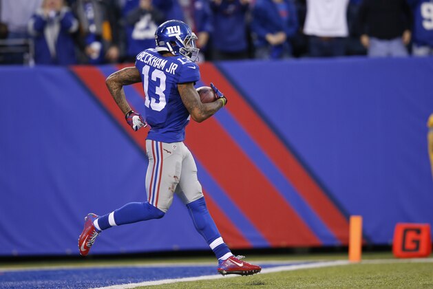 New York Giants' Odell Beckham (13) backs into the end zone for a touchdown during the second half of an NFL football game against the Philadelphia Eagles Sunday, Dec. 28, 2014, in East Rutherford, N.J. (AP Photo/Kathy Willens)