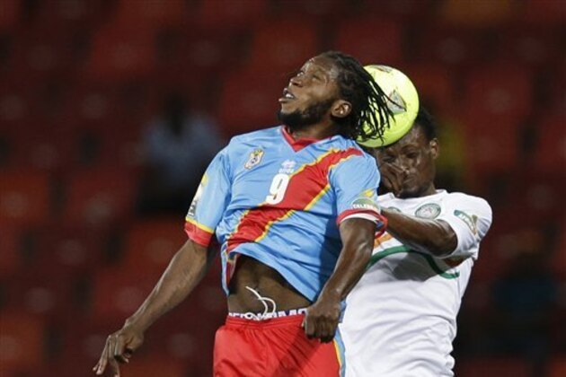 Niger's Fatoghoma Kourouma, right, challenges Congo's Dieumerci Mbokani in their African Cup of Nations Group B soccer match, at Nelson Mandela Bay Stadium in Port Elizabeth, South Africa, Thursday, Jan. 24, 2013. (AP Photo/Rebecca Blackwell)