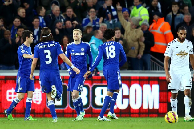 SWANSEA, WALES - JANUARY 17:  Andre Schurrle of Chelsea (3rd L) celebrates with team-mates after scoring the team's fifth goal during the Barclays Premier League match between Swansea City and Chelsea at Liberty Stadium on January 17, 2015 in Swansea, Wales.  (Photo by Richard Heathcote/Getty Images)