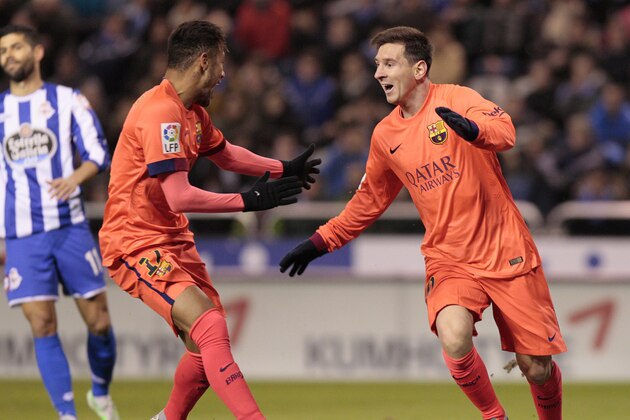 Barcelona's Lionel Messi, right, celebrates after scoring against Deportivo with teammate Neymar during a Spanish La Liga soccer match at the Riazor stadium in A Coruna, Spain, Sunday, Jan. 18, 2015. (AP Photo/Lalo R. Villar)