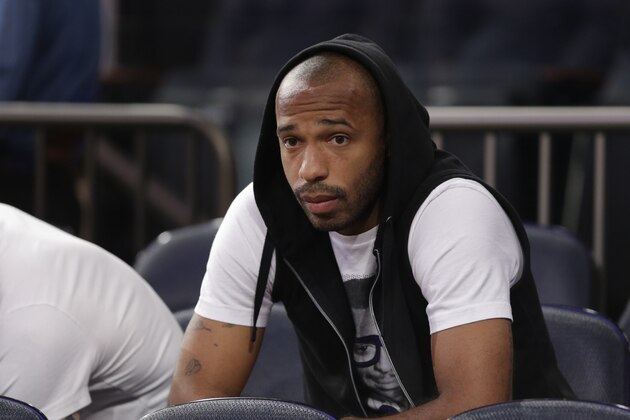 New York Red Bulls soccer player Thierry Henry waits for the start of Game 5 of an NBA basketball playoff series between the New York Knicks and the Indiana Pacers in the Eastern Conference semifinals at Madison Square Garden in New York, Thursday, May 16, 2013. (AP Photo/Julio Cortez)