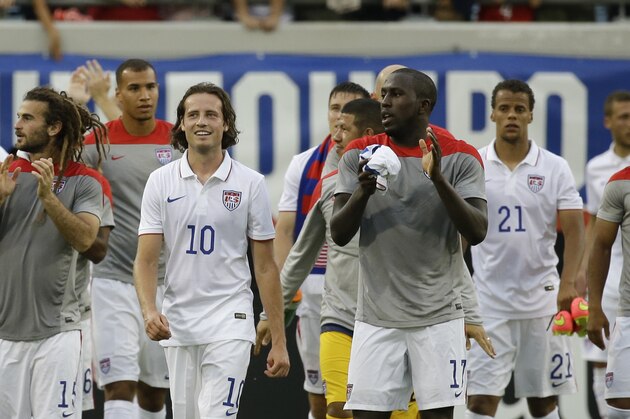 Players of the United States national team including, Kyle Beckerman, far left, Mikkel Diskerud (10), Jozy Altidore (17), Timothy Chandler (21), DeAndre Yedlin (2) and Aron Johannsson (9) walk around the field to cheering fans after defeating Nigeria 2-1 in an international friendly soccer match in Jacksonville, Fla., Saturday, June 7, 2014. The United States won 2-1. (AP Photo/John Raoux)