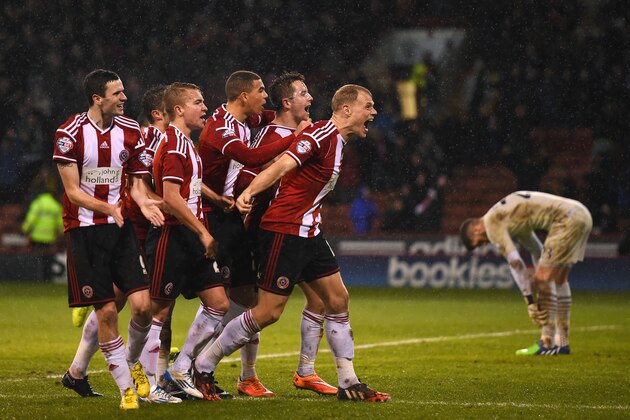 SHEFFIELD, ENGLAND - DECEMBER 16:  Marc McNulty of Sheffield United (protective mask) celebrates scoring the opening goal with team mates during the Capital One Cup Quarter-Final match between Sheffield United and Southampton at Bramall Lane on December 16, 2014 in Sheffield, England.  (Photo by Shaun Botterill/Getty Images)