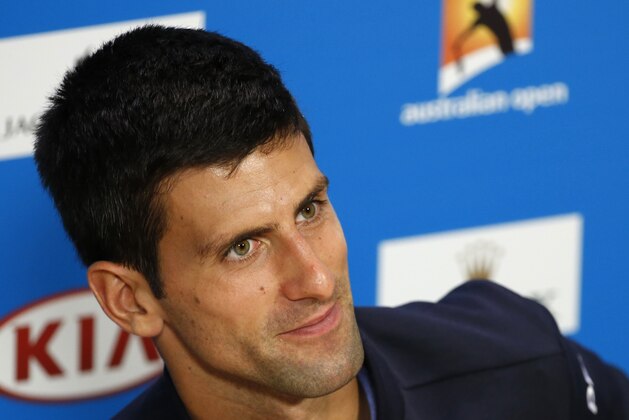 Novak Djokovic of Serbia smiles during a press conference at the Australian Open tennis championship in Melbourne, Australia, Sunday, Jan. 18, 2015. (AP Photo/Vincent Thian)