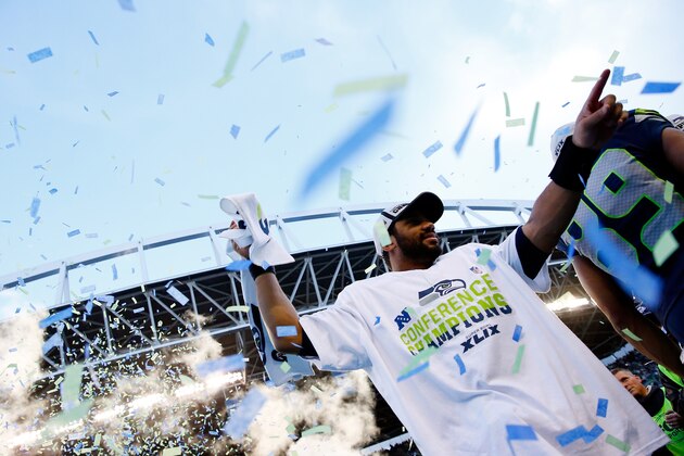 SEATTLE, WA - JANUARY 18:  Russell Wilson #3 of the Seattle Seahawks celebrates after the Seahawks defeated the Green Bay Packers in the 2015 NFC Championship game at CenturyLink Field on January 18, 2015 in Seattle, Washington.  (Photo by Tom Pennington/Getty Images)
