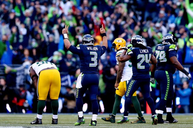 SEATTLE, WA - JANUARY 18:  Quarterback Russell Wilson #3 of the Seattle Seahawks celebrates after throwing the game winning touchdown pass to Jermaine Kearse #15 in overtime to defeat the Green Bay Packers 28-22 during the 2015 NFC Championship game at CenturyLink Field on January 18, 2015 in Seattle, Washington.  (Photo by Ronald Martinez/Getty Images)