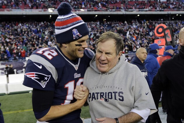 New England Patriots quarterback Tom Brady, left, celebrates with head coach Bill Belichick after defeating the Miami Dolphins 41-13 in an NFL football game Sunday, Dec. 14, 2014, in Foxborough, Mass. (AP Photo/Charles Krupa)