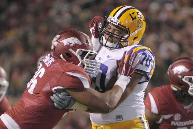 LSU offensive tackle La'El Collins (70) and Arkansas defensive end Trey Flowers face off in an NCAA college football game in Fayetteville, Ark., Saturday, Nov. 15, 2014. (AP Photo/David Quinn)