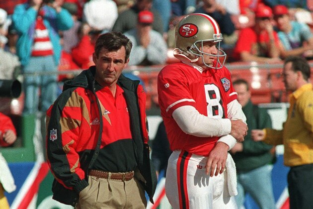 San Francisco 49ers coach Mike Shanahan, left, and quarterback Steve Young stand on the sidelines in San Francisco on Jan. 15, 1995 prior to the game against the Dallas Cowboys.  (AP Photo/Paul Sakuma)