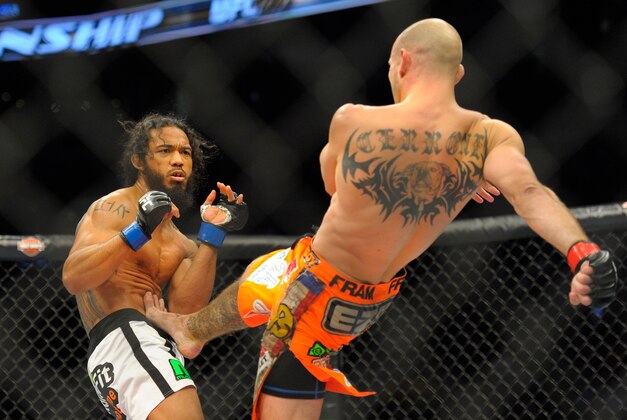 Jan 18, 2015; Boston, MA, USA; Donald Cerrone (red) and Benson Henderson (blue) compete during a lightweight bout at UFC Fight Night at TD Garden. Mandatory Credit: Bob DeChiara-USA TODAY Sports