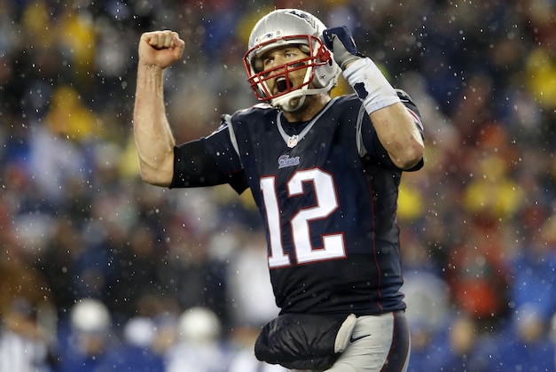 Jan 18, 2015; Foxborough, MA, USA; New England Patriots quarterback Tom Brady (12) pumps his fists as he heads to the sideline in the fourth quarter against the Indianapolis Colts the AFC Championship Game at Gillette Stadium. Mandatory Credit: David Butler II-USA TODAY Sports