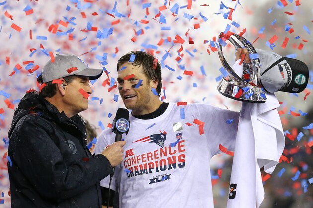 FOXBORO, MA - JANUARY 18:  Tom Brady #12 of the New England Patriots holds up the Lamar Hunt Trophy after defeating the Indianapolis Colts in the 2015 AFC Championship Game at Gillette Stadium on January 18, 2015 in Foxboro, Massachusetts.  The Patriots defeated the Colts 45-7.  (Photo by Maddie Meyer/Getty Images)