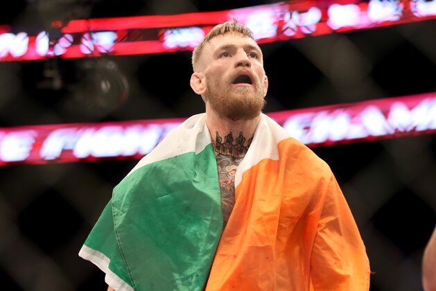 Conor McGregor, of Ireland, celebrates a win against Dennis Siver, of Germany, after their featherweight fight at UFC Fight Night, Sunday, Jan. 18, 2015 in Boston.  McGregor won via 2nd round TKO. (AP Photo/Gregory Payan)