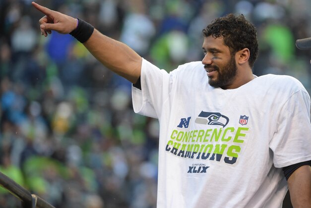 Jan 18, 2015; Seattle, WA, USA; Seattle Seahawks quarterback Russell Wilson celebrates following their victory over the Green Bay Packers in the NFC Championship Game at CenturyLink Field. The Seahawks defeated the Packers 28-22 in overtime. Mandatory Credit: Kirby Lee-USA TODAY Sports