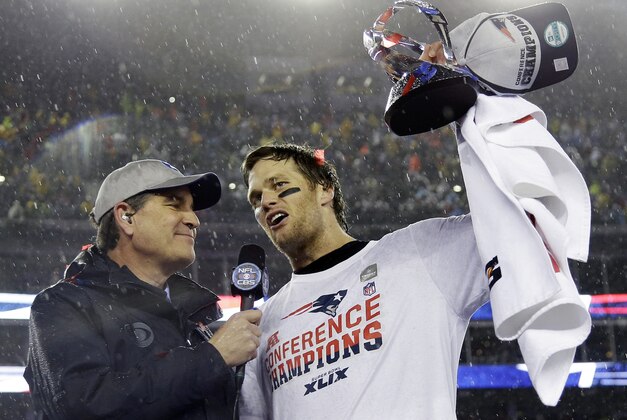 New England Patriots quarterback Tom Brady, right, holds the championship trophy while being interviewed by Jim Nance after the NFL football AFC Championship game Sunday, Jan. 18, 2015, in Foxborough, Mass. The Patriots defeated the Colts 45-7 to advance to the Super Bowl against the Seattle Seahawks. (AP Photo/Matt Slocum)