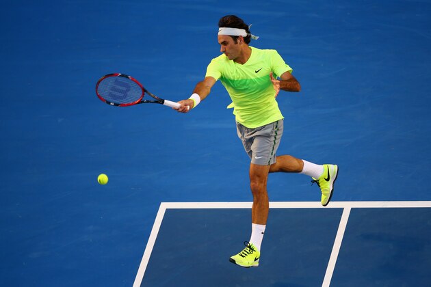MELBOURNE, AUSTRALIA - JANUARY 19:  Roger Federer of Switzerland plays a forehand in his first round match against Yen-Hsun Lu of Chinese Taipei during day one of the 2015 Australian Open at Melbourne Park on January 19, 2015 in Melbourne, Australia.  (Photo by Clive Brunskill/Getty Images)