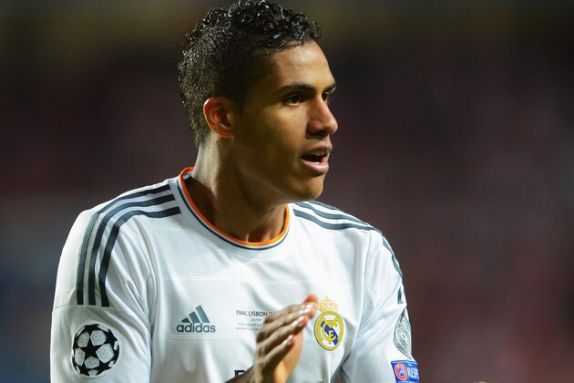LISBON, PORTUGAL - MAY 24:  Raphael Varane of Real Madrid applauds during the UEFA Champions League Final between Real Madrid and Atletico de Madrid at Estadio da Luz on May 24, 2014 in Lisbon, Portugal.  (Photo by Michael Regan/Getty Images)