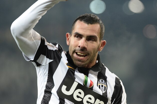 Juventus forward Carlos Tevez celebrates after scoring during a Serie A soccer match between Juventus and Hellas Verona at the Juventus stadium in Turin, Italy, Sunday, Jan. 18, 2015. (AP Photo/Massimo Pinca)