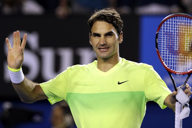 Roger Federer of Switzerland celebrates after beating Lu Yen-Hsun of Taiwan during their first round match at the Australian Open tennis championship in Melbourne, Australia, Monday, Jan. 19, 2015. (AP Photo/Bernat Armangue)