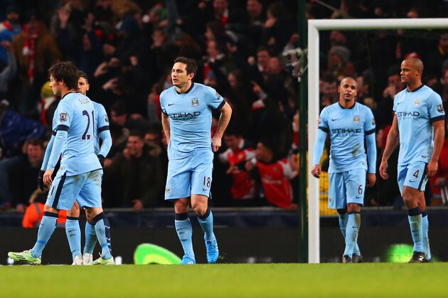 MANCHESTER, ENGLAND - JANUARY 18:  David Silva, Frank Lampard, Fernando and Vincent Kompany of Manchester City look dejected during the Barclays Premier League match between Manchester City and Arsenal at Etihad Stadium on January 18, 2015 in Manchester, England.  (Photo by Alex Livesey/Getty Images)