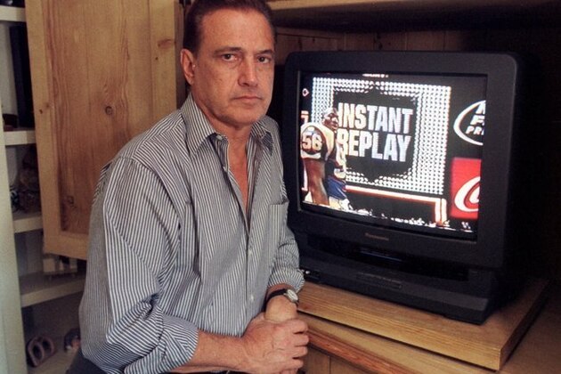 ** FILE ** In this Nov. 26, 1999 file photo, Tony Verna poses in his home in Pacific Palisades, Calif.  Verna, a Philadelphia native, was just 29 when he lauched the first instant replay during the 64th annual Army-Navy football game in 1963. (AP Photo/Chris Pizzello, File)