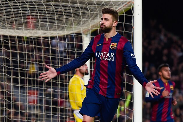 BARCELONA, SPAIN - DECEMBER 20:  Gerard Pique of FC Barcelona celebrates scoring his team's third goal during the La Liga match between FC Barcelona and Cordoba CF at Camp Nou on December 20, 2014 in Barcelona, Spain.  (Photo by David Ramos/Getty Images)