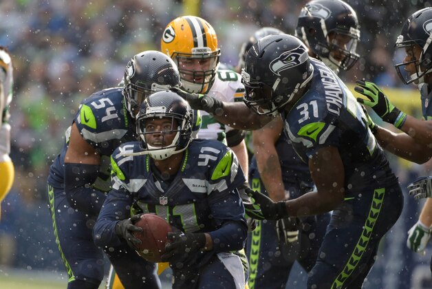 Jan 18, 2015; Seattle, WA, USA; Seattle Seahawks cornerback Byron Maxwell (41) celebrates his second quarter interception with Bobby Wagner (54) and Kam Chancellor (31) against the Green Bay Packers in the NFC Championship Game at CenturyLink Field. Mandatory Credit: Kirby Lee-USA TODAY Sports