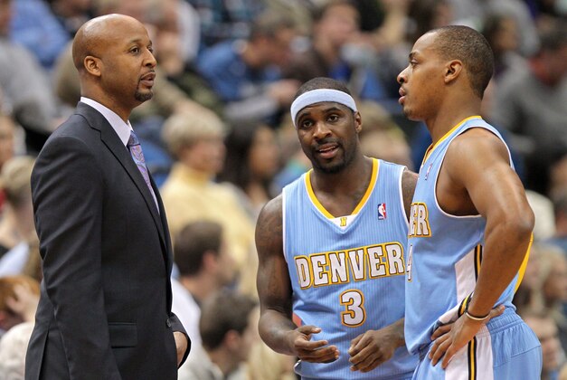 Nov 27, 2013; Minneapolis, MN, USA; Denver Nuggets head coach Brian Shaw talks with guard Ty Lawson (3) and guard Randy Foye (4) against the Minnesota Timberwolves at Target Center. The Nuggets defeated the Timberwolves 117-110. Mandatory Credit: Brace Hemmelgarn-USA TODAY Sports