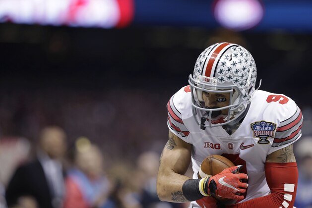 Ohio State wide receiver Devin Smith (9) makes a catch against Alabama in the first half of the Sugar Bowl NCAA college football playoff semifinal game, Thursday, Jan. 1, 2015, in New Orleans. (AP Photo/Brynn Anderson)