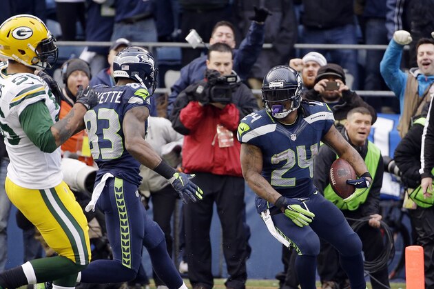 Seattle Seahawks' Marshawn Lynch (24) runs into the end zone for a touchdown during the second half of the NFL football NFC Championship game against the Green Bay Packers Sunday, Jan. 18, 2015, in Seattle. (AP Photo/David J. Phillip)