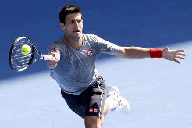 Novak Djokovic of Serbia returns a forehand shot during a training session at the Australian Open tennis championship in Melbourne, Australia, Sunday, Jan. 18, 2015. (AP Photo/Lee Jin-man)