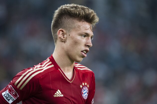GUANGZHOU, GUANGDONG - JULY 26:  Mitchell Weiser of Bayern Munich in action during a friendly match against VfL Wolfsburg as part of the Audi Football Summit 2012 on July 26, 2012 at the Guangdong Olympic Sports Center in Guangzhou, China.  (Photo by Victor Fraile/Getty Images)