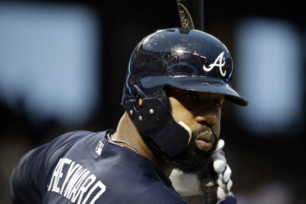 Atlanta Braves' Jason Heyward takes some warm up swings on deck against the Texas Rangers during a baseball game, Friday, Sept. 12, 2014, in Arlington, Texas. (AP Photo/Tony Gutierrez)