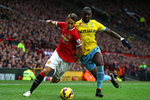MANCHESTER, ENGLAND - NOVEMBER 08:  Adnan Januzaj of Manchester United competes with Yannick Bolasie of Crystal Palace during the Barclays Premier League match between Manchester United and Crystal Palace at Old Trafford on November 8, 2014 in Manchester, England.  (Photo by Clive Rose/Getty Images)