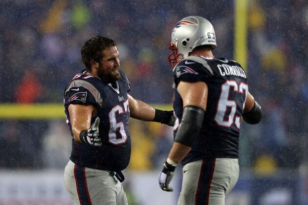 FOXBORO, MA - JANUARY 18:  Josh Kline #67 of the New England Patriots celebrates with teammate  Dan Connolly #63 in the third quarter against the Indianapolis Colts of the 2015 AFC Championship Game at Gillette Stadium on January 18, 2015 in Foxboro, Massachusetts.  (Photo by Elsa/Getty Images)